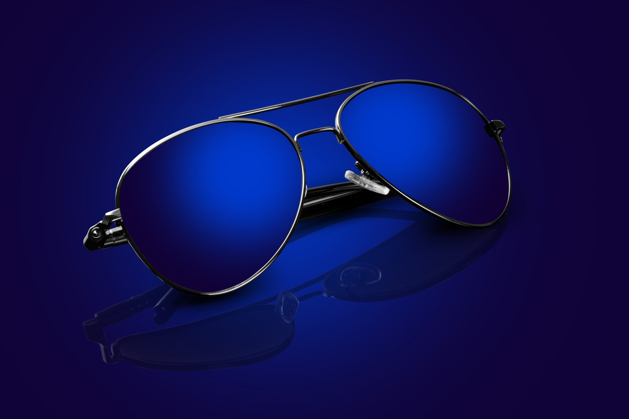Blue sunglasses on dark background