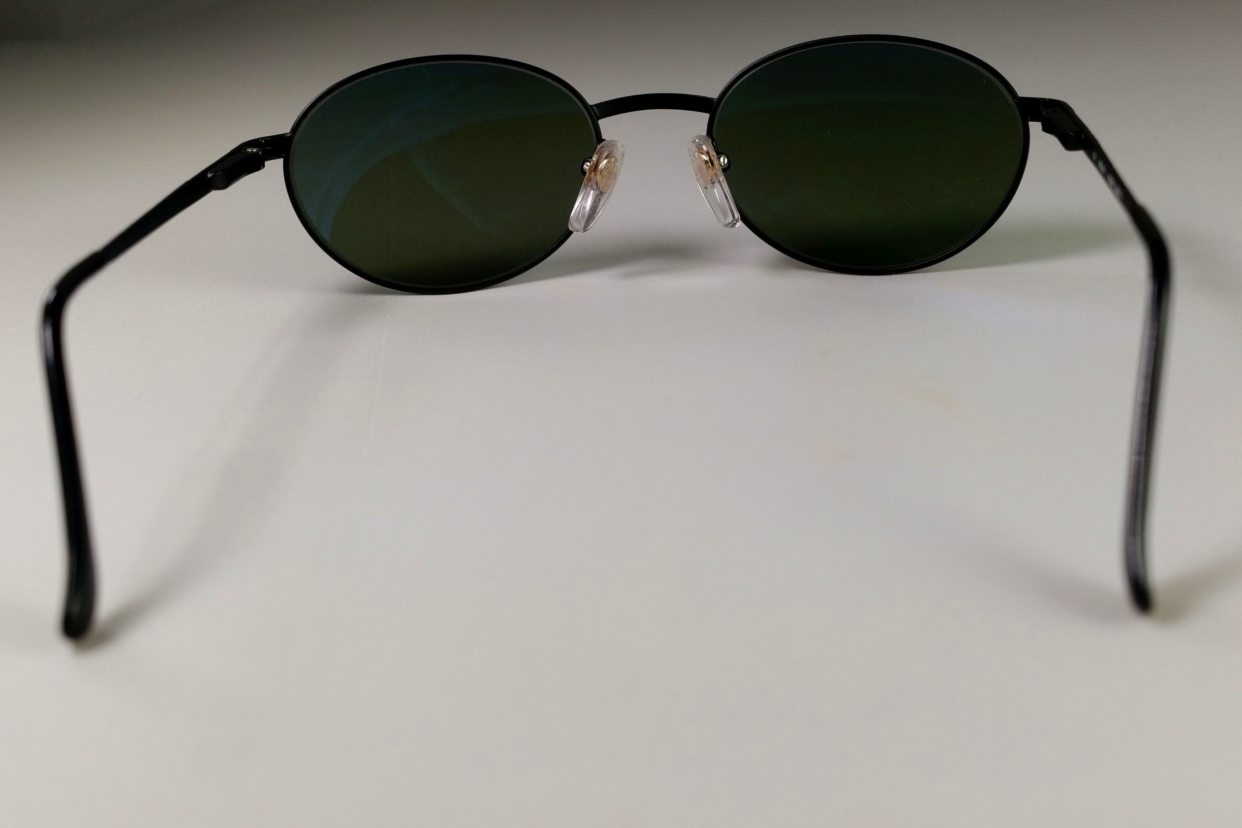 Eyewear with dark lenses and nose pads
