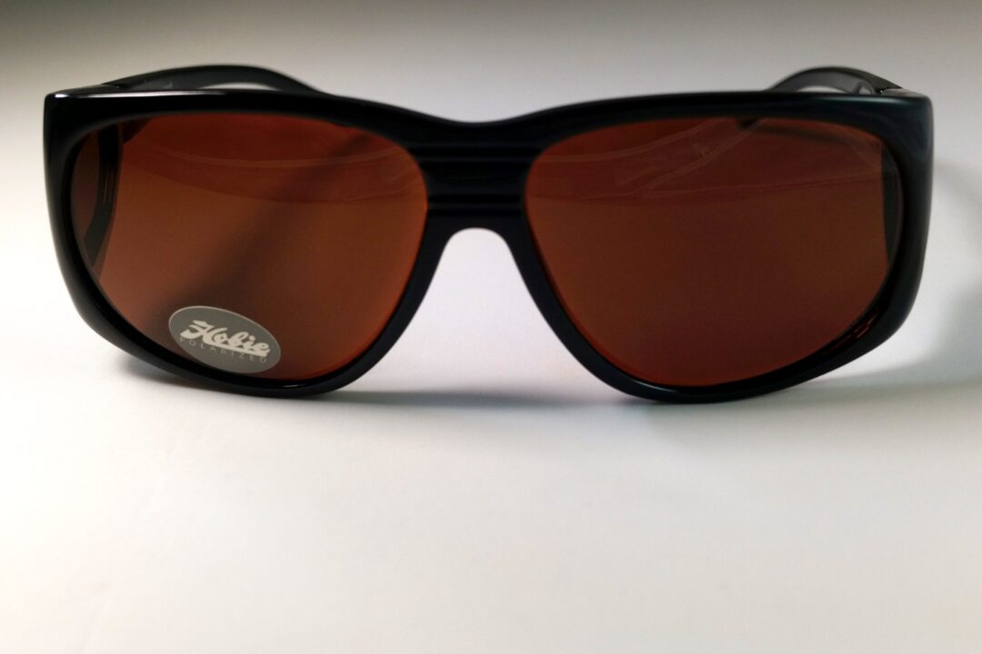 Stylish sunglasses on white background