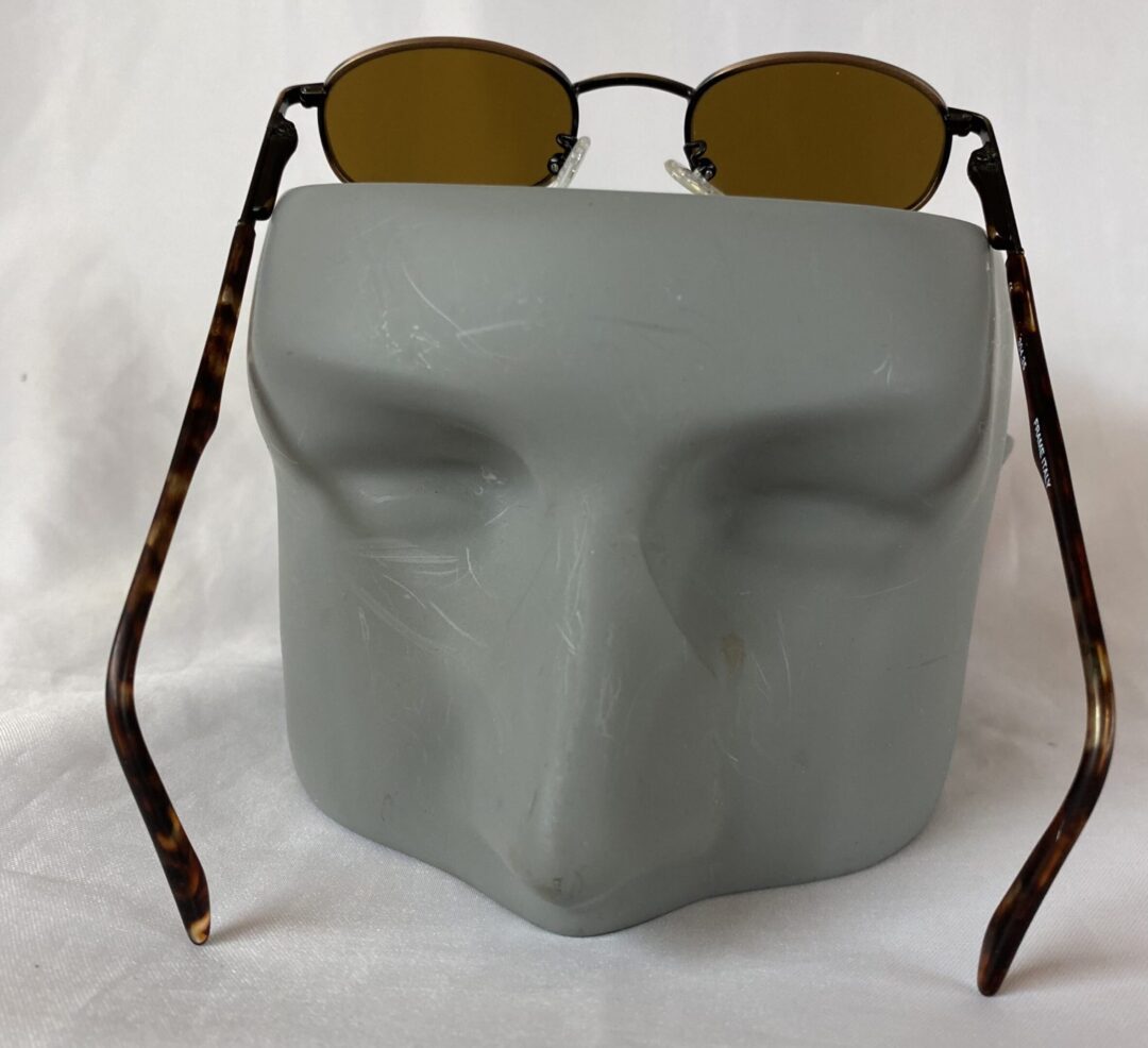 Tortoiseshell sunglasses on display stand