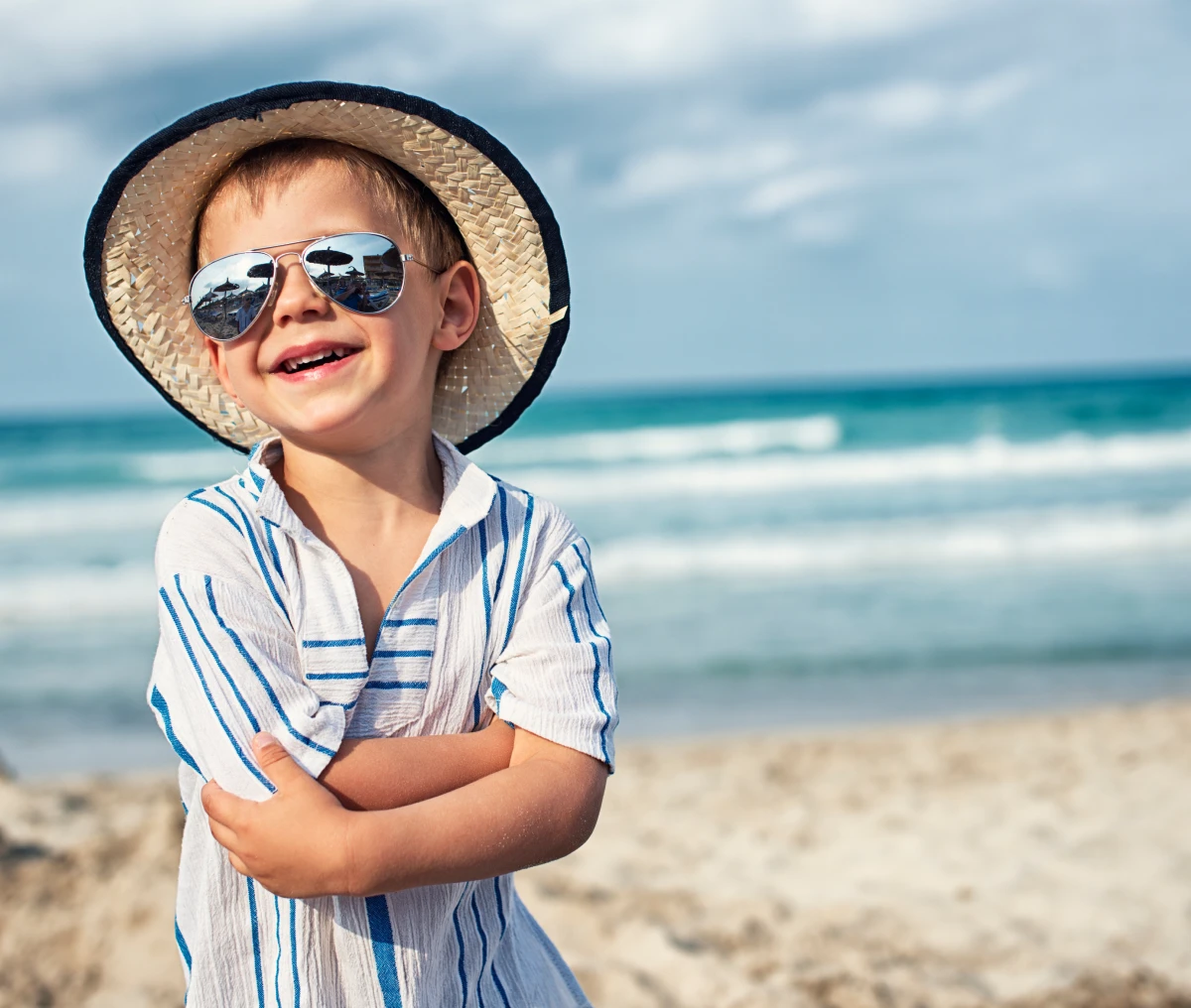 Boy wearing sunglasses and hat