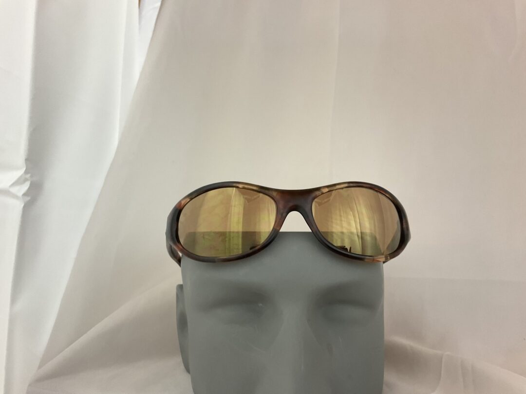 Sunglasses on a gray mannequin head